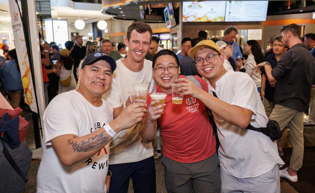 Brewers cheers together and enjoy beers at a Brew Asia social gathering